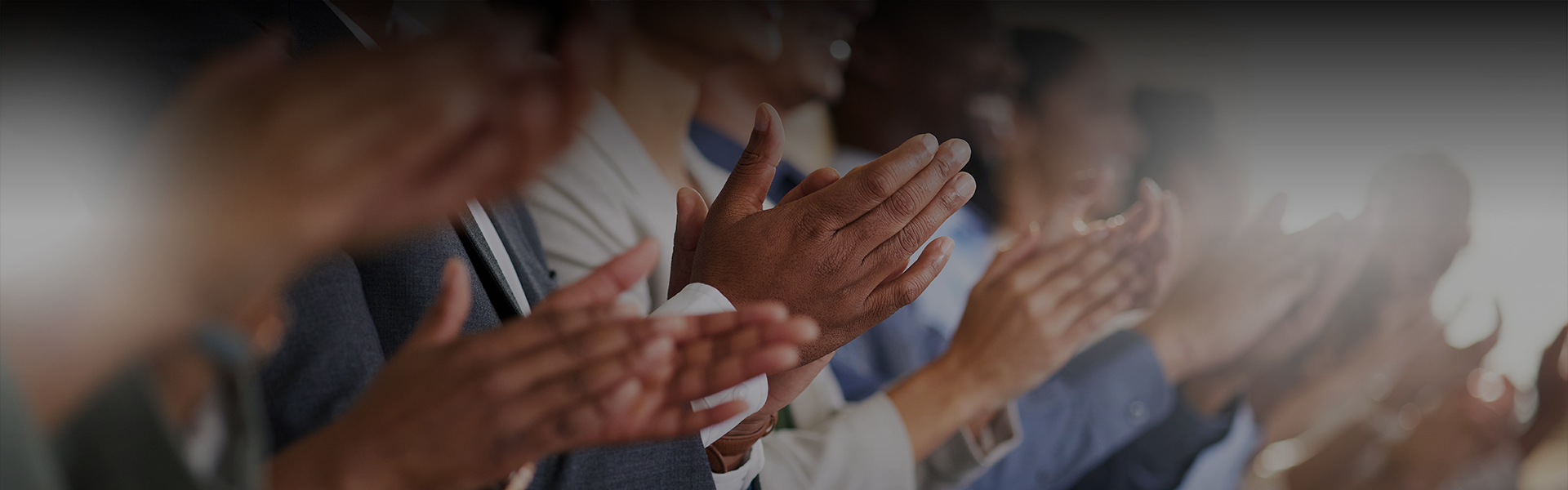 Hands clapping together celebrating achievements
